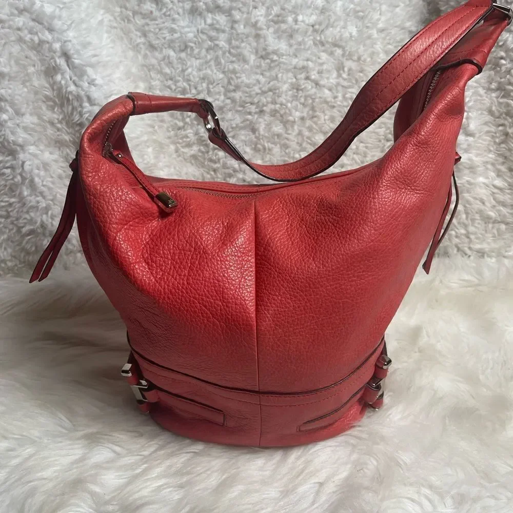 B Makowsky leather orange Hobo bucket style shoulder bag  silver tone hardwares